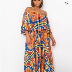 Off Shoulder Maxi Dress is made from a satin fabric with a pleated flowy body
